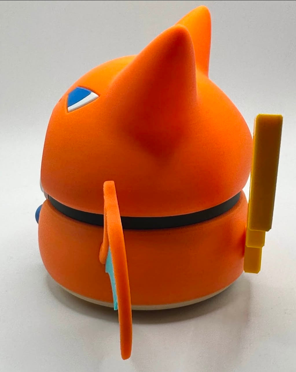 Pikachu figure wearing a Charizard poncho