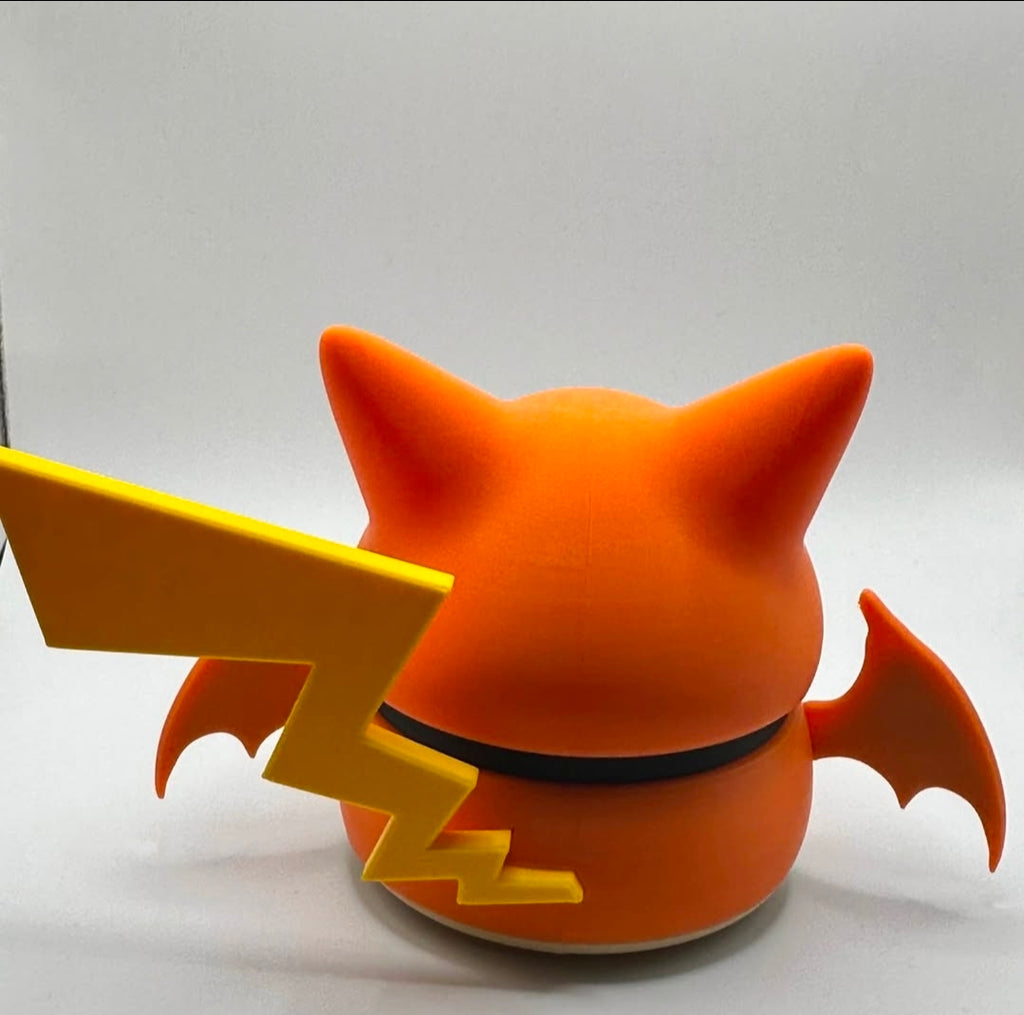 Pikachu figure wearing a Charizard poncho